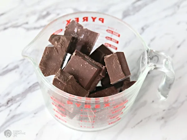 chocolate chunks in a pyrex measuring cup.