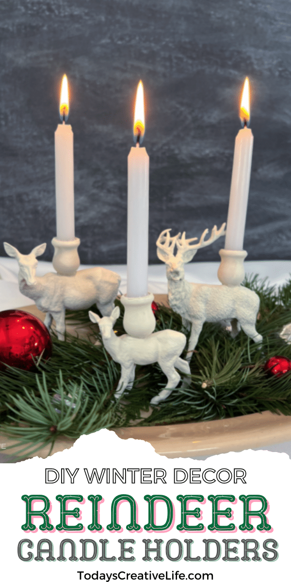 Black background with spray painted plastic reindeer and small candles glued to the top for Christmas candle holders.