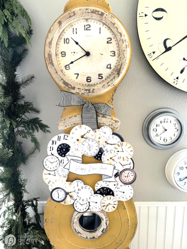 NYE Wreath hanging on gold grandfather clock.