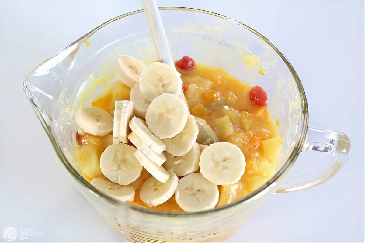 Vanilla pudding Fruit Cocktail ingredients in a glass bowl.