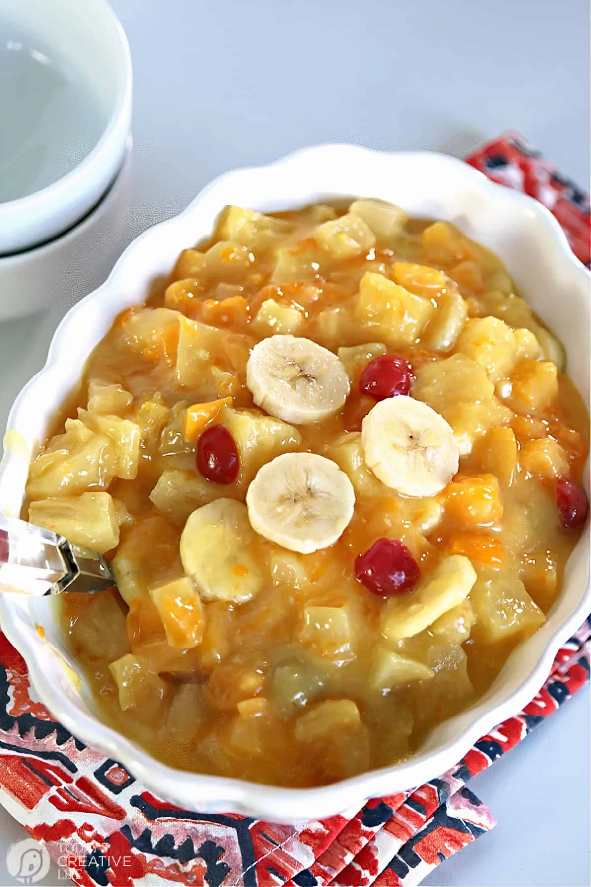 White bowl filled with Vanilla Pudding Fruit Cocktail Recipe.