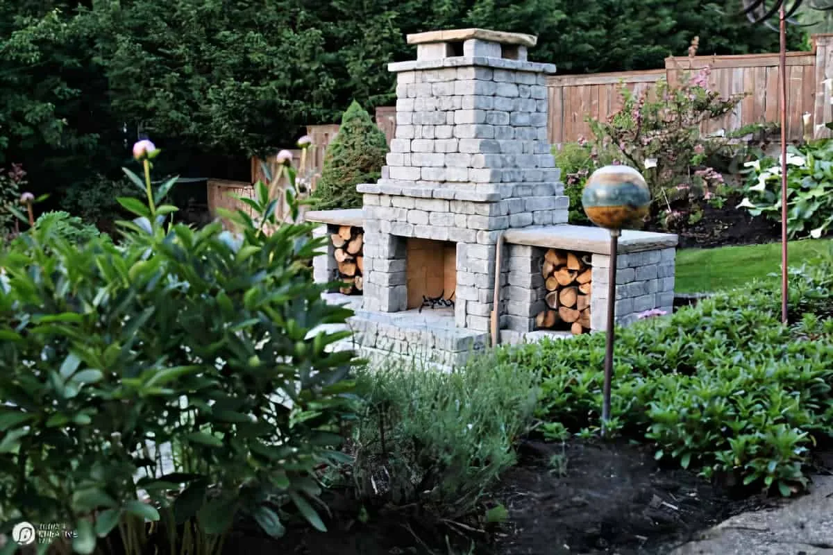 Outdoor Fireplace in a lush backyard